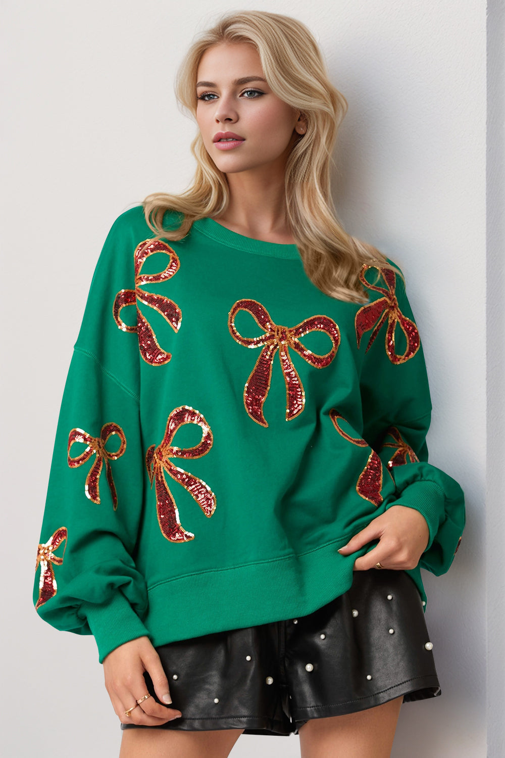 Felpa natalizia Double Take con fiocco e paillettes | Scollo rotondo e spalle a contrasto