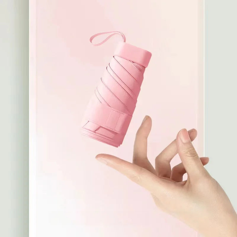 Mini-parapluie résistant aux UV et imperméable, compact pour voyages et excursions