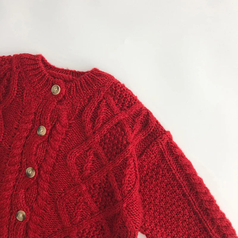 Rode gebreide babytrui voor herfst en winter 2