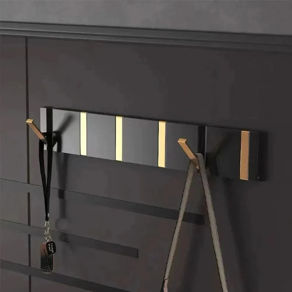 Ganci da parete – Design pieghevole, metallo robusto e montaggio salvaspazio